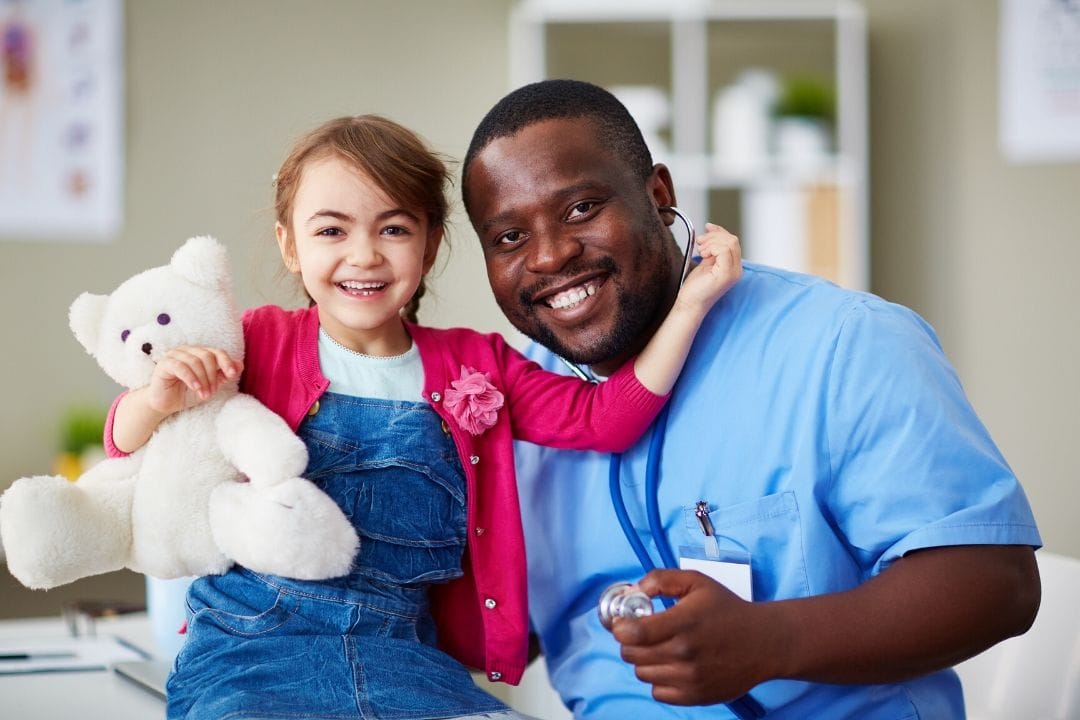 kid with a nurse at a clinic