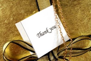 present with a thank you note