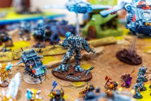 painted figurines on a warhammer 40000 game board