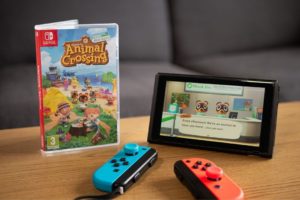 animal crossing game next to nintendo switch console