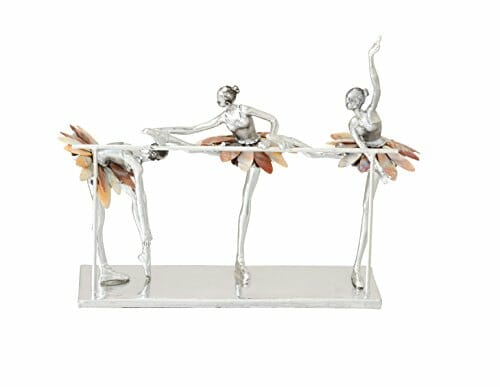 little statues shaped like ballet dancers
